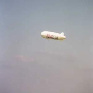 Towed Inflatable Blimp Pulled by a Boat at Sea